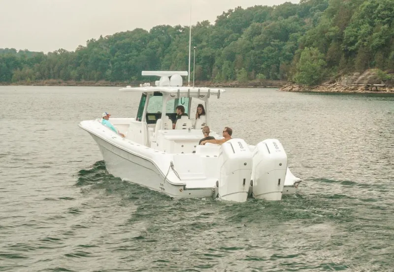 Slide: The Image of 2023 HCB 39 Speciale boat cruising on a lake with passengers. - 15