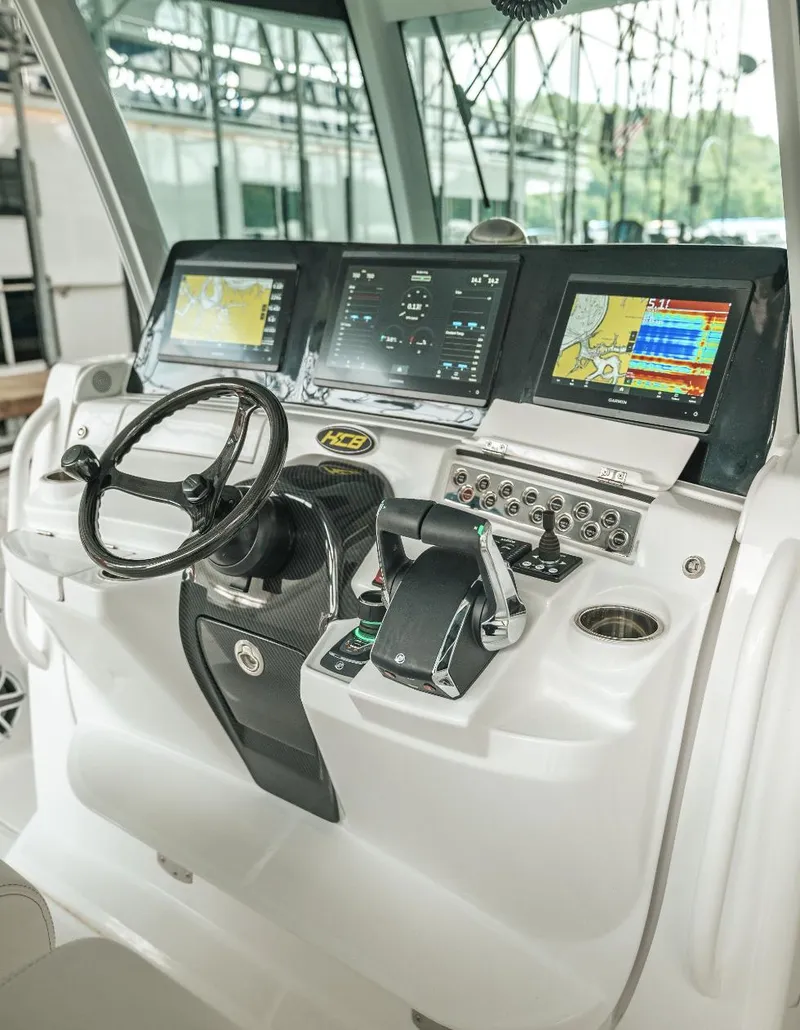 Slide: The Image of Helm of 2023 HCB 39 Speciale with advanced navigation displays and controls. - 17