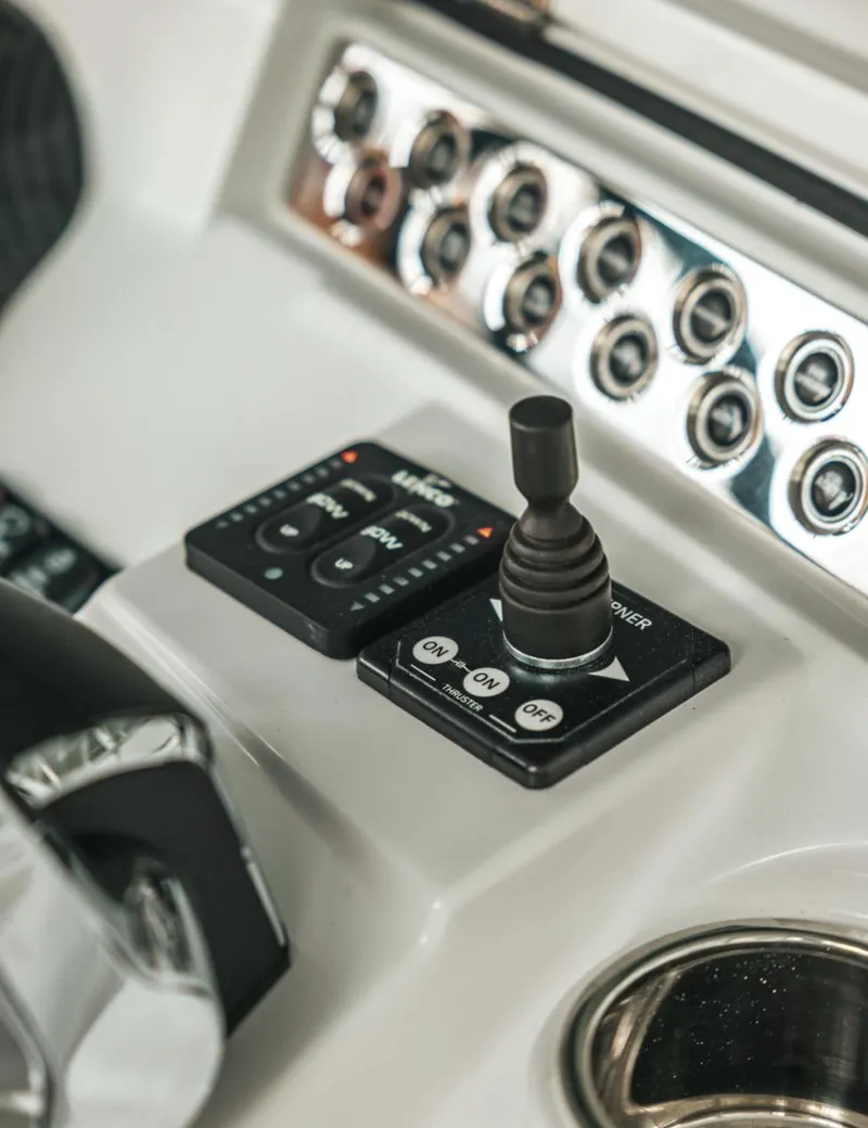 Slide: The Image of Control panel of the 2023 HCB 39 Speciale boat with joystick and buttons. - 18