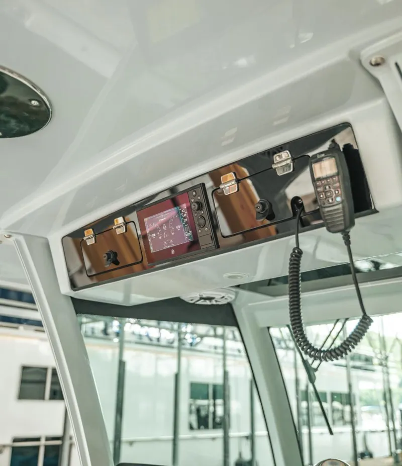Slide: The Image of Control panel of 2023 HCB 39 Speciale boat with radio and navigation system. - 19