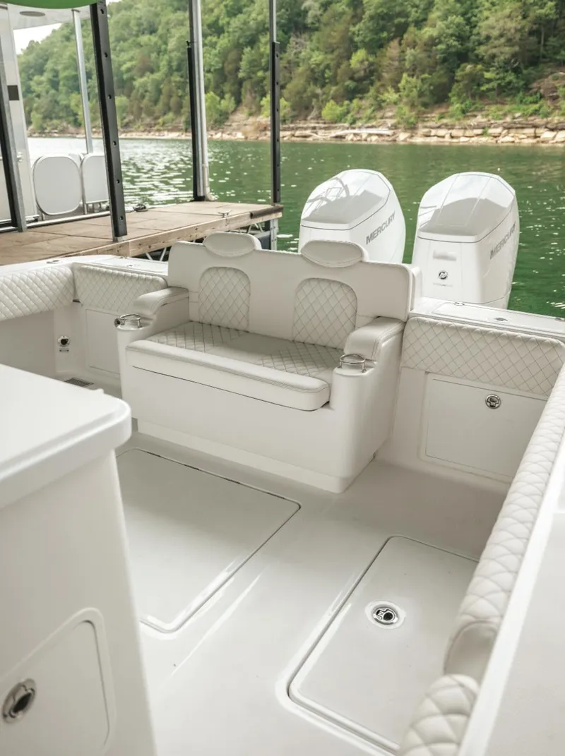 Slide: The Image of 2023 HCB 39 Speciale boat interior with seating and outboard motors. - 25