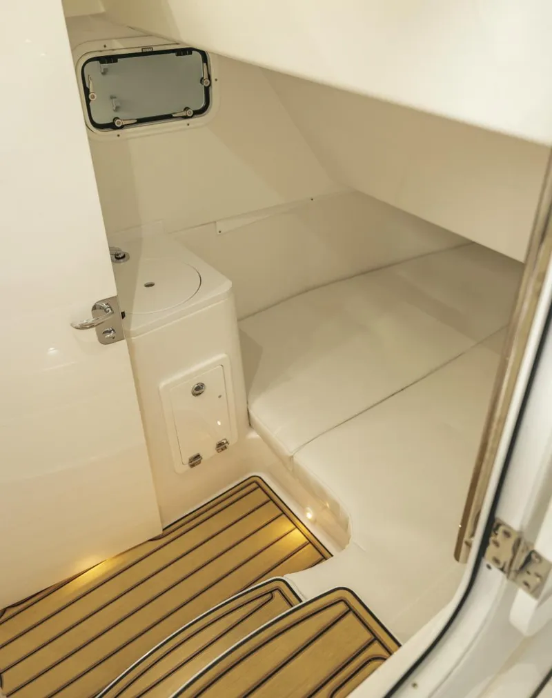 Slide: The Image of 2023 HCB 39 Speciale cabin interior with wooden flooring and white seating. - 26