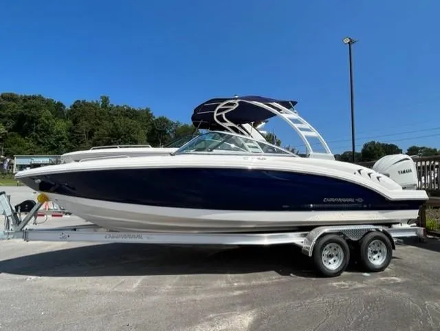 The Image of 2023 Chaparral 23 SSi OB boat on trailer, side view. - 1