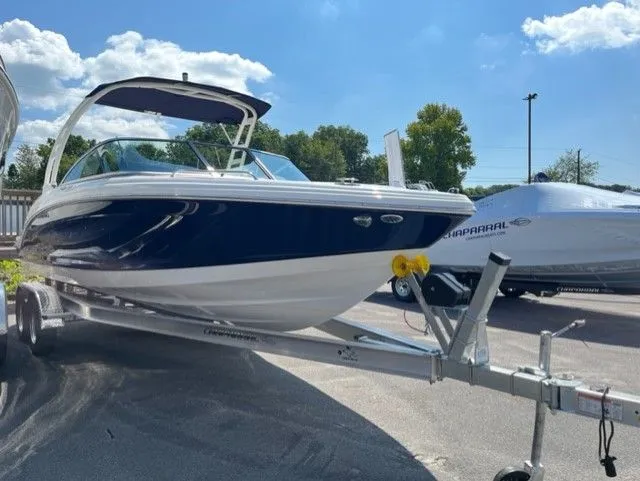 Slide: The Image of Chaparral 23 SSi OB 2023 on trailer under sunny skies. - 3