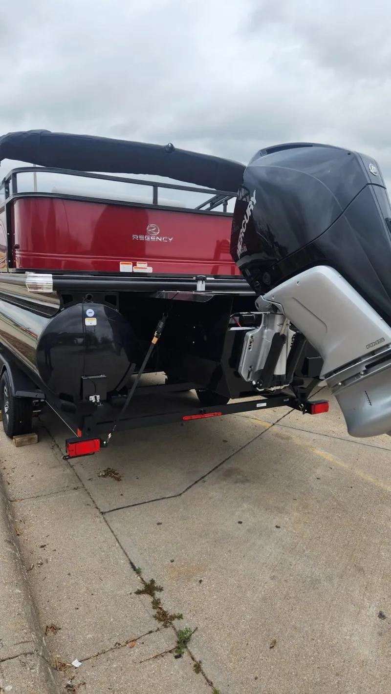 Slide: The Image of 2023 Regency 250 DL3 pontoon boat with outboard motor. - 7