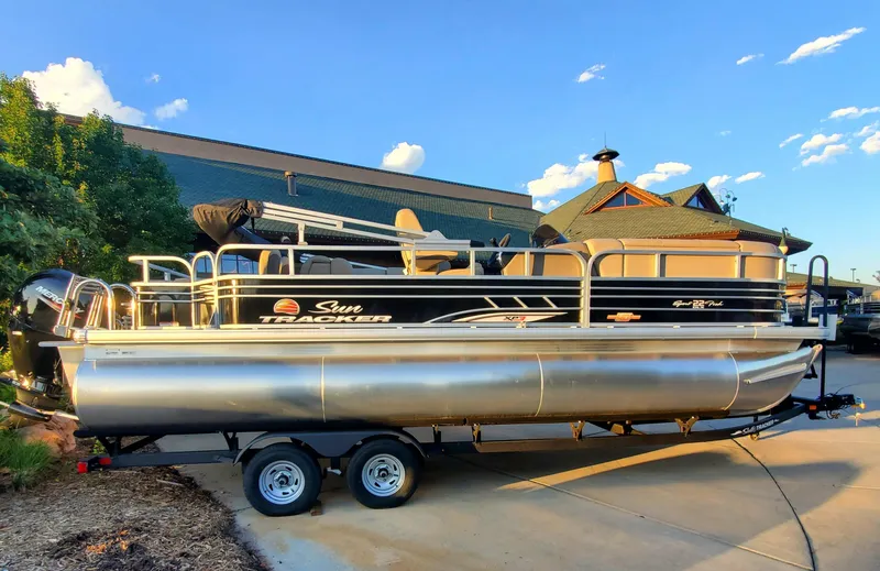 The Image of 2023 Sun Tracker SportFish 22 XP3 pontoon boat on trailer. - 0