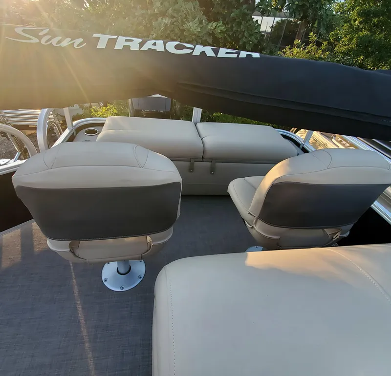 Slide: The Image of Interior of 2023 Sun Tracker SportFish 22 XP3 pontoon boat with beige seating. - 4