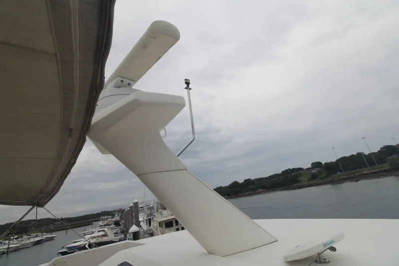 Slide: The Image of 2000 Silverton 392 Motor Yacht radar equipment with marina background. - 11