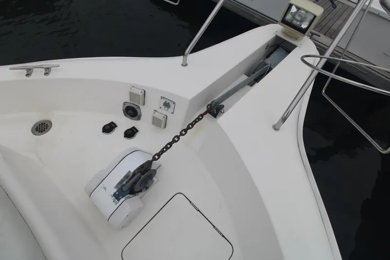 Slide: The Image of Bow of 2000 Silverton 392 Motor Yacht with anchor chain and deck fittings. - 12