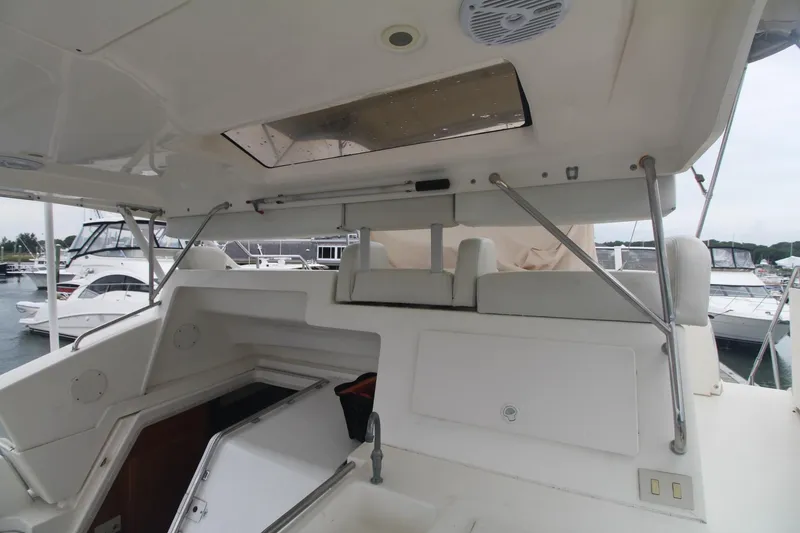 Slide: The Image of 2000 Silverton 392 Motor Yacht interior with open hatch and seating area. - 14