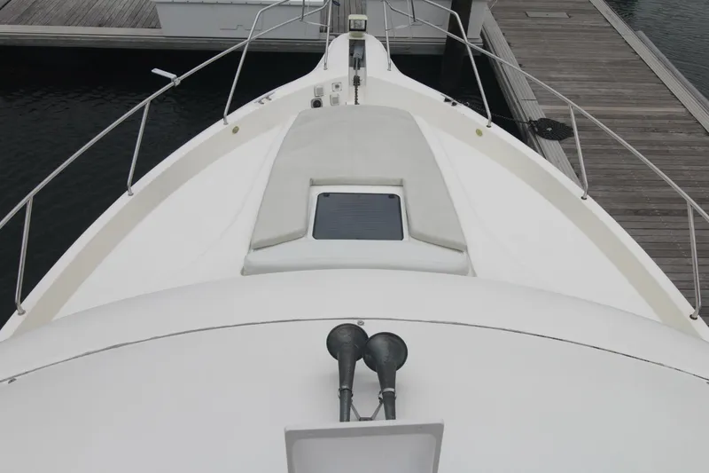 Slide: The Image of Bow view of 2000 Silverton 392 Motor Yacht docked at marina. - 15
