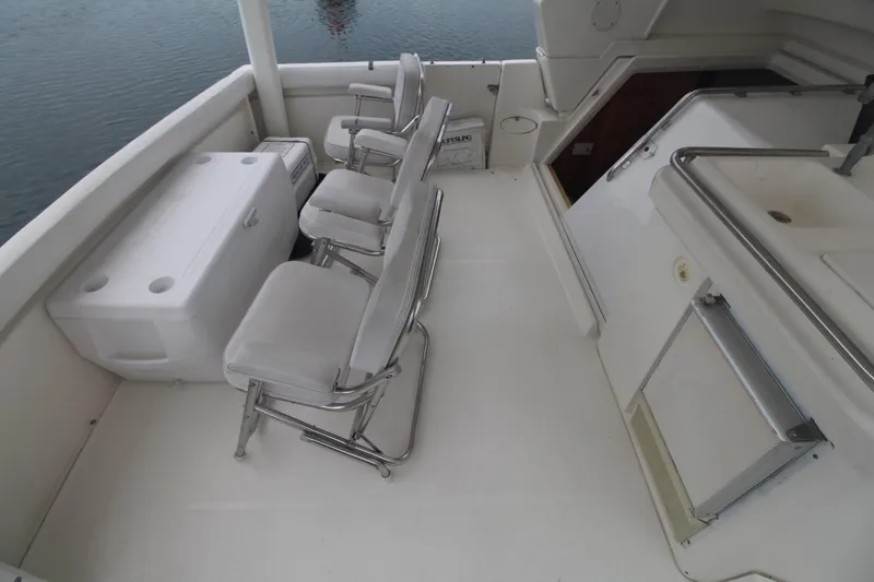Slide: The Image of 2000 Silverton 392 Motor Yacht deck with seating and storage. - 17