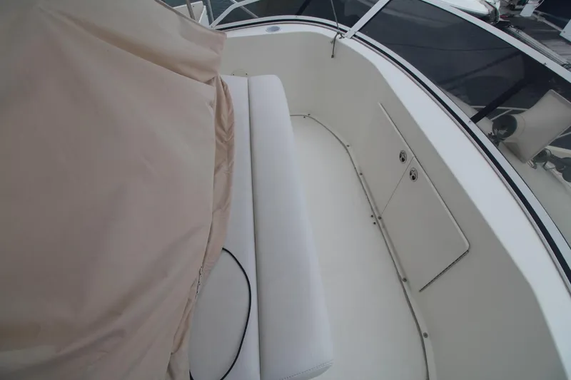 Slide: The Image of 2000 Silverton 392 Motor Yacht deck with seating and protective cover. - 21