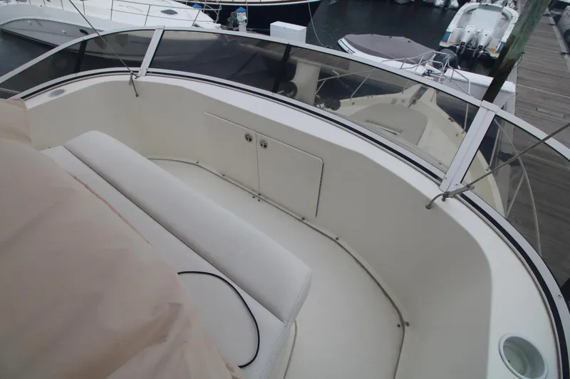 Slide: The Image of 2000 Silverton 392 Motor Yacht deck with seating and storage, docked at marina. - 22