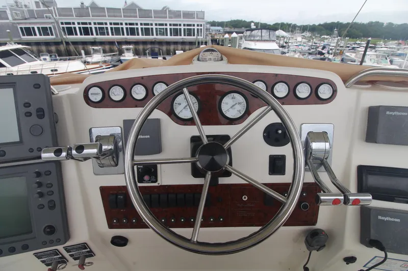 Slide: The Image of Helm of 2000 Silverton 392 Motor Yacht with gauges and navigation equipment. - 23