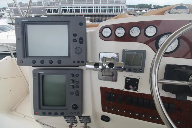 Slide: The Image of Control panel of a 2000 Silverton 392 Motor Yacht with navigation instruments and gauges. - 24