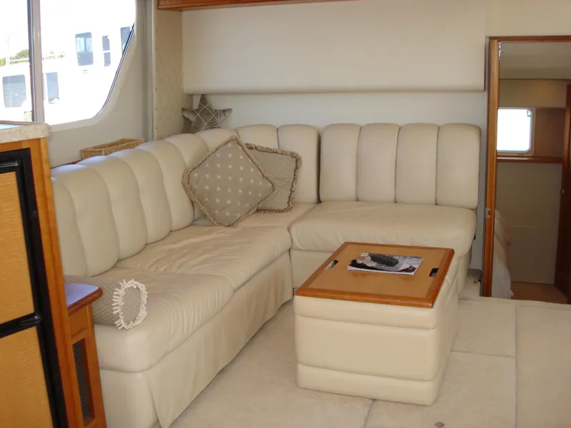 Slide: The Image of Luxurious interior of 2000 Silverton 392 Motor Yacht with plush seating and elegant decor. - 28