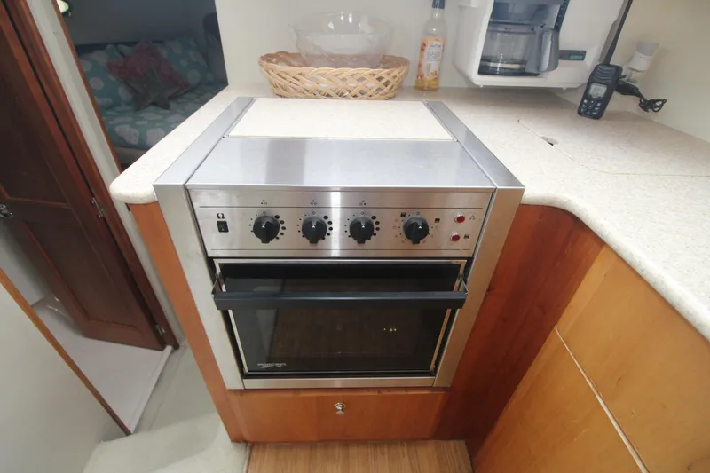 Slide: The Image of Stainless steel oven in 2000 Silverton 392 Motor Yacht kitchen area. - 29