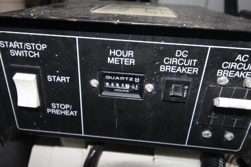 Slide: The Image of Control panel of a 2000 Silverton 392 Motor Yacht with hour meter and circuit breakers. - 31