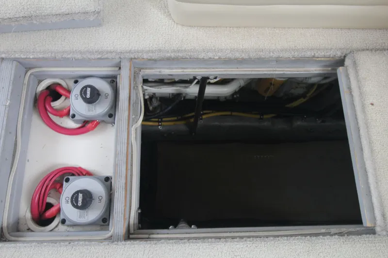 Slide: The Image of Battery compartment of a 2000 Silverton 392 Motor Yacht with visible wiring and switches. - 32