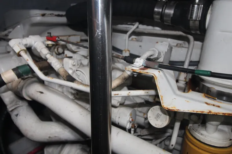 Slide: The Image of Engine components of a 2000 Silverton 392 Motor Yacht, showing pipes and connections. - 33
