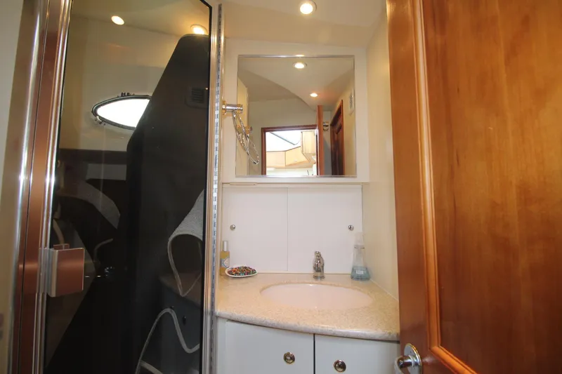 Slide: The Image of Bathroom interior of 2000 Silverton 392 Motor Yacht with shower and vanity. - 42
