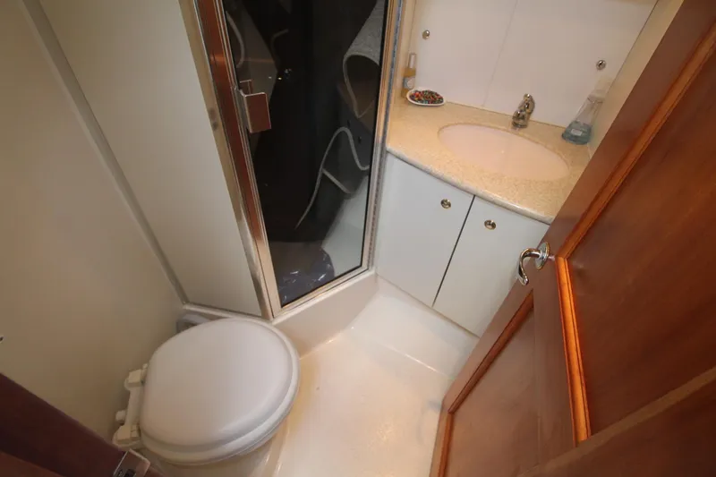Slide: The Image of Bathroom interior of 2000 Silverton 392 Motor Yacht with shower and sink. - 43