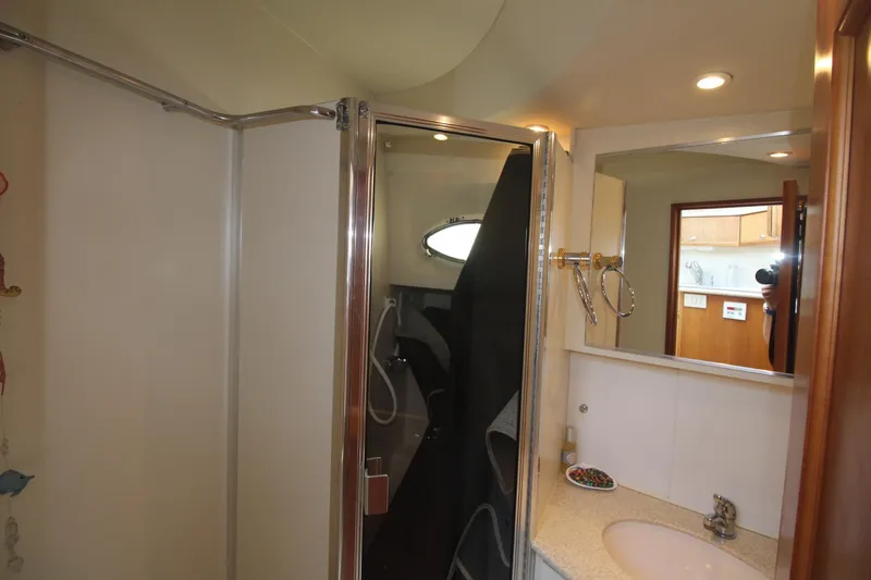 Slide: The Image of Bathroom interior of 2000 Silverton 392 Motor Yacht with shower and sink. - 44