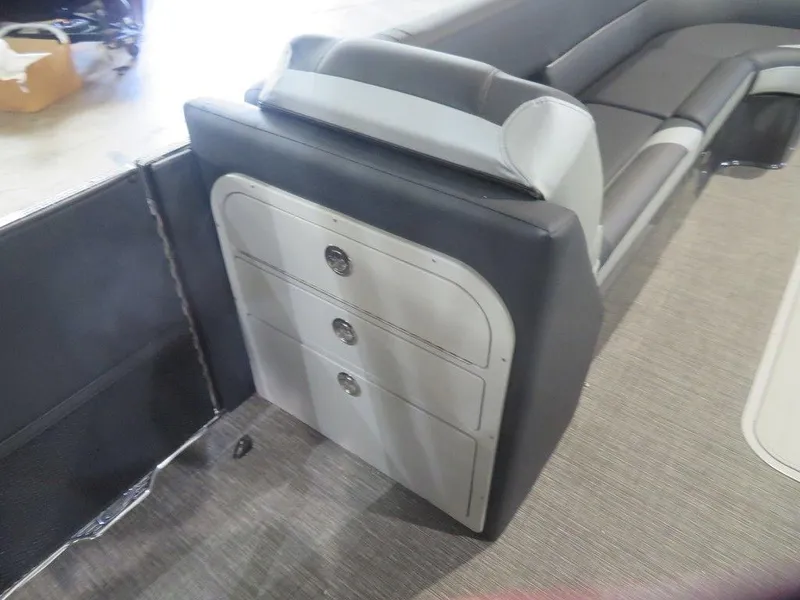 Slide: The Image of 2023 Crest Caribbean RS 250 SLS CP3 boat interior with storage compartments and seating. - 13