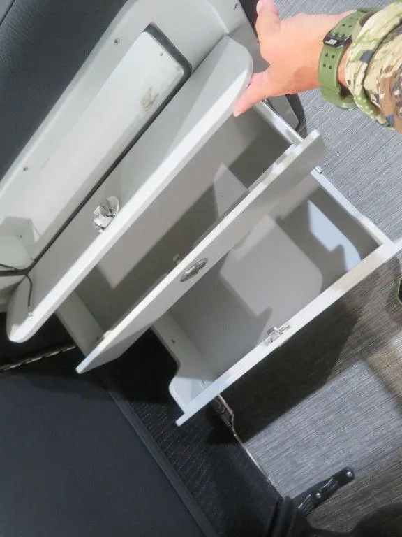 Slide: The Image of 2023 Crest Caribbean RS 250 SLS CP3 storage compartments being opened. - 16