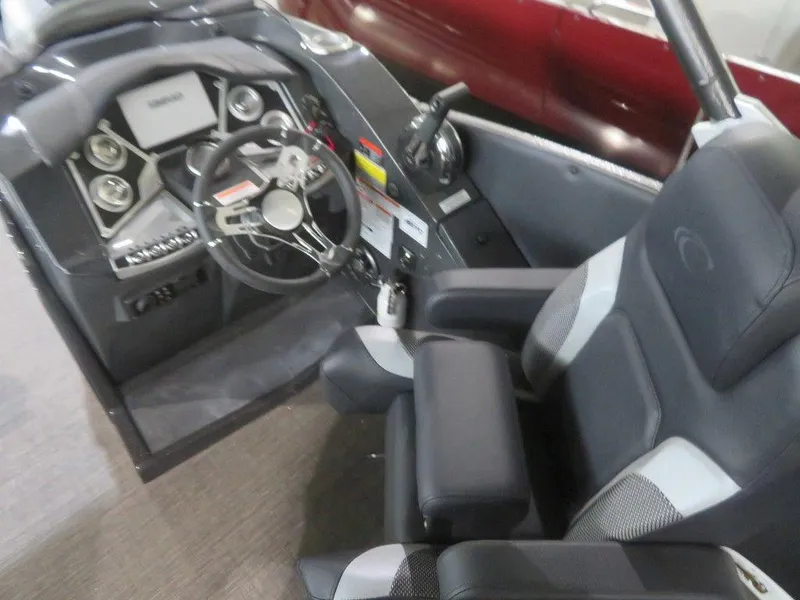 Slide: The Image of 2023 Crest Caribbean RS 250 SLS CP3 boat cockpit with steering wheel and captain's chair. - 18