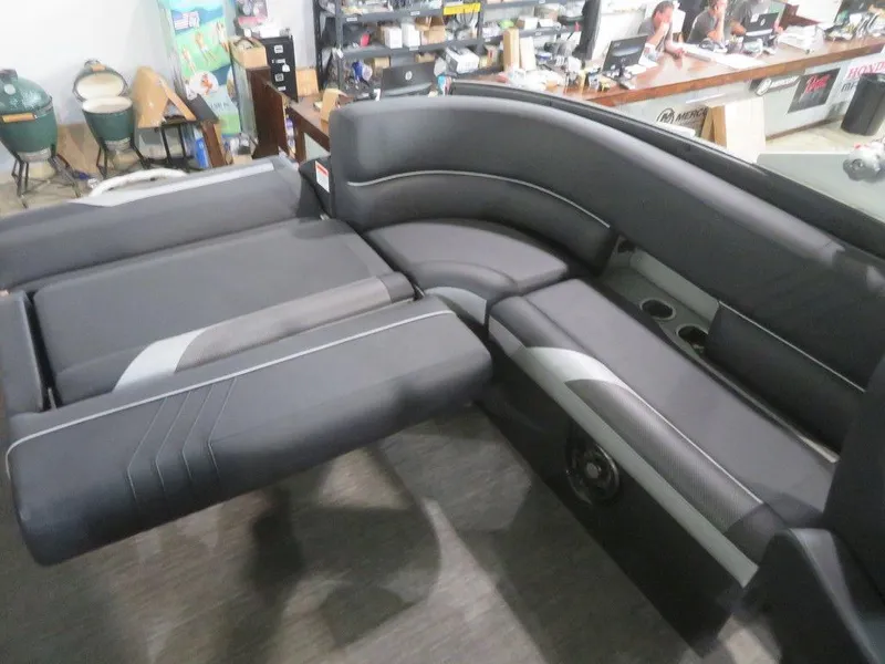 Slide: The Image of 2023 Crest Caribbean RS 250 SLS CP3 boat interior seating in showroom. - 20