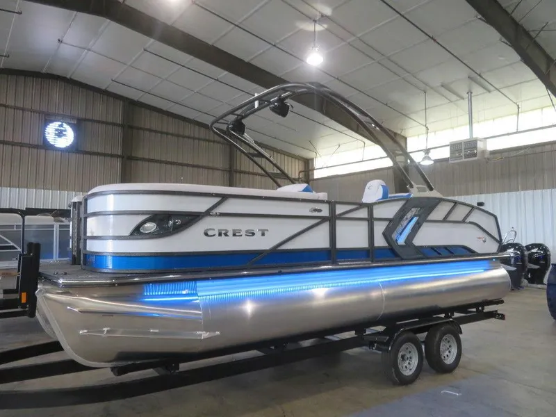 Slide: The Image of 2023 Crest Caribbean RS 230 SLC CP3 pontoon boat in a showroom. - 1