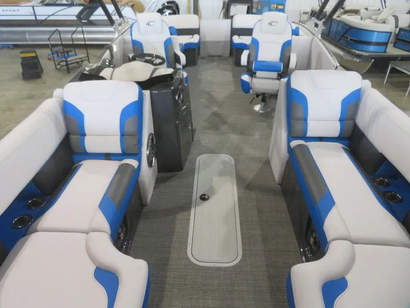 Slide: The Image of 2023 Crest Caribbean RS 230 SLC CP3 pontoon boat interior with blue and white seating. - 10
