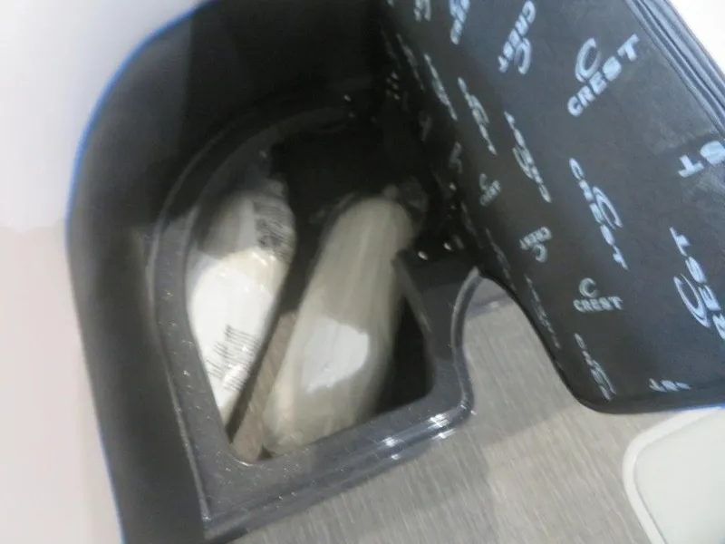 Slide: The Image of 2023 Crest Caribbean RS 230 SLC CP3 storage compartment with Crest-branded cover. - 12