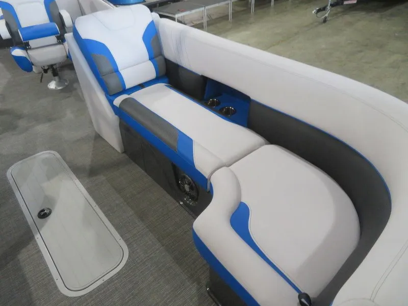 Slide: The Image of 2023 Crest Caribbean RS 230 SLC CP3 boat interior seating with blue and gray upholstery. - 13