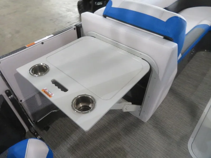 Slide: The Image of 2023 Crest Caribbean RS 230 SLC CP3 boat interior with foldable table and cup holders. - 18