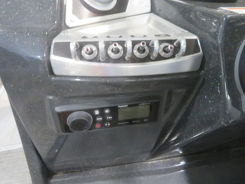 Slide: The Image of Control panel of 2023 Crest Caribbean RS 230 SLC CP3 boat with Fusion audio system. - 20