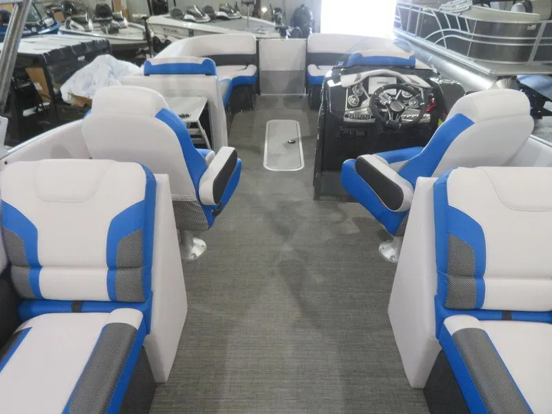 Slide: The Image of 2023 Crest Caribbean RS 230 SLC CP3 pontoon boat interior with blue and white seating. - 25