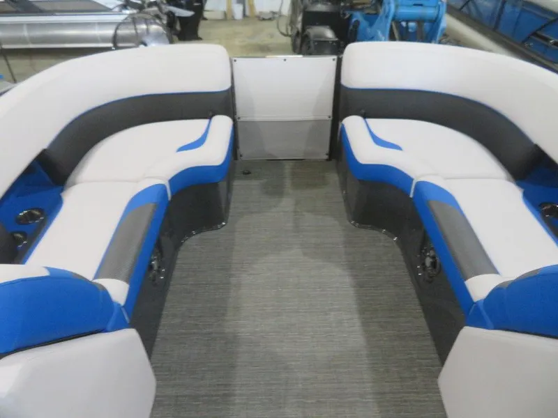 Slide: The Image of 2023 Crest Caribbean RS 230 SLC CP3 boat interior with blue and white seating. - 27