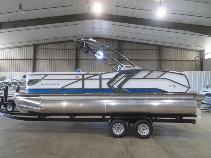 Slide: The Image of 2023 Crest Caribbean RS 230 SLC CP3 pontoon boat in a warehouse. - 3