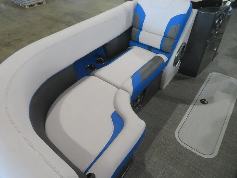 Slide: The Image of 2023 Crest Caribbean RS 230 SLC CP3 boat interior with blue and white seating. - 8