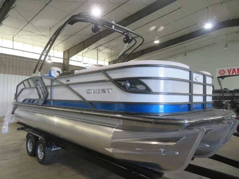 Slide: The Image of 2023 Crest Caribbean RS 230 SLC CP3 pontoon boat in a showroom. - 9
