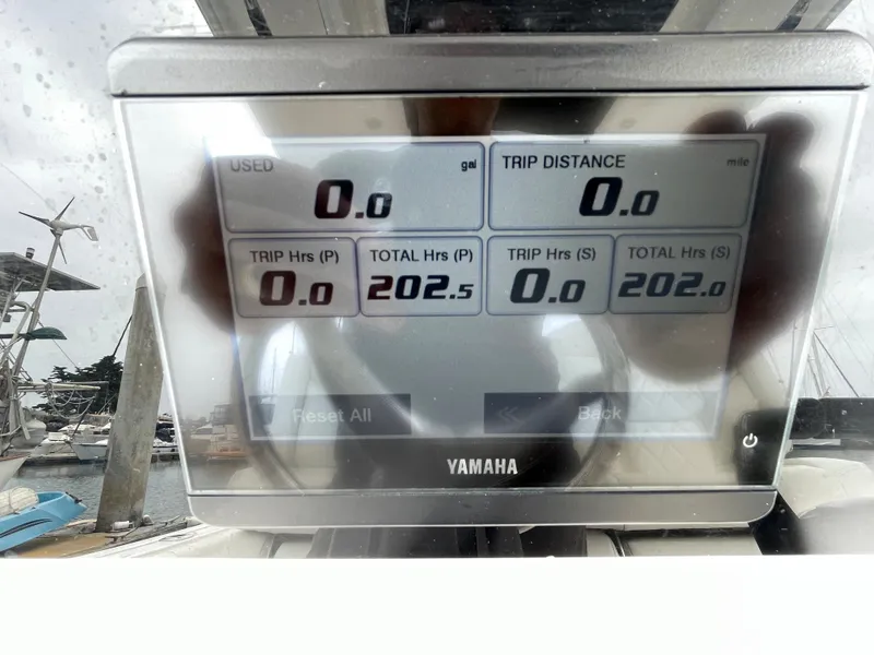 Slide: The Image of 2021 Edgewater 262CC center console boat interior at marina. - 10