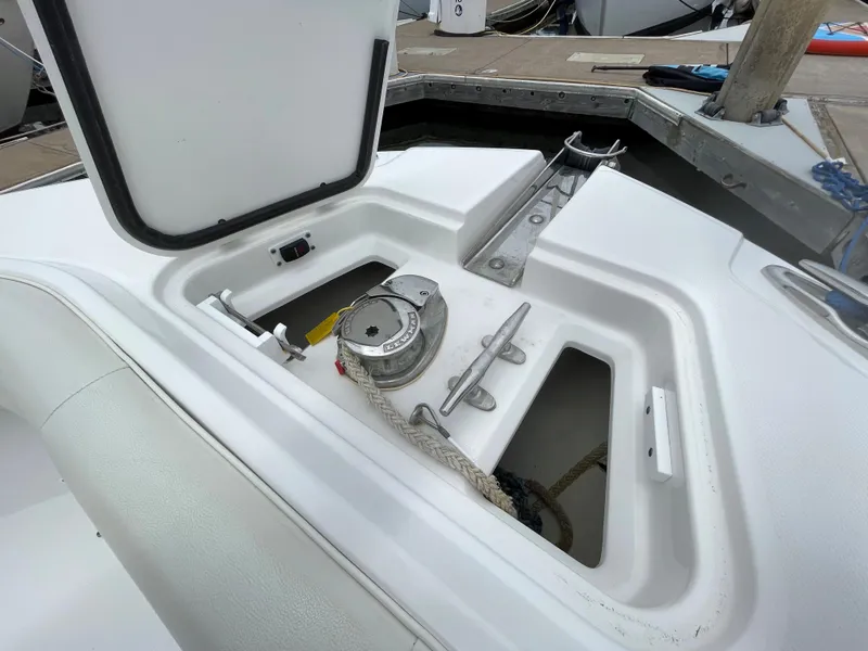 Slide: The Image of 2021 Edgewater 262CC boat dashboard with steering wheel and control panel. - 11
