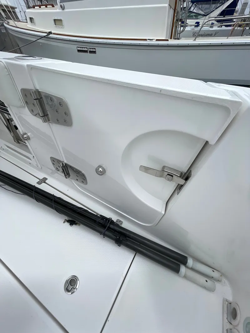 Slide: The Image of 2021 Edgewater 262CC boat interior with dual captain's chairs at the helm. - 16