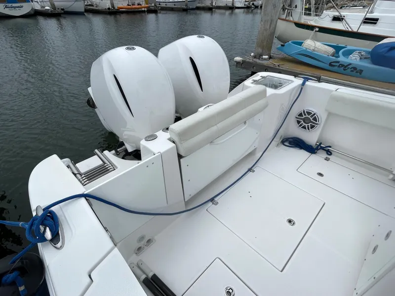 Slide: The Image of 2021 Edgewater 262CC boat docked in a marina. - 4