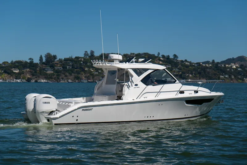 Slide: The Image of 2024 Pursuit OS 325 Offshore boat cruising on a sunny day. - 2