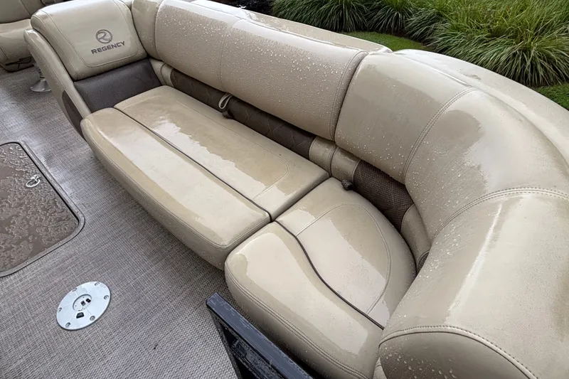 Slide: The Image of Luxurious beige seating on 2023 Regency 230 LE3 boat, featuring sleek design and comfort. - 8
