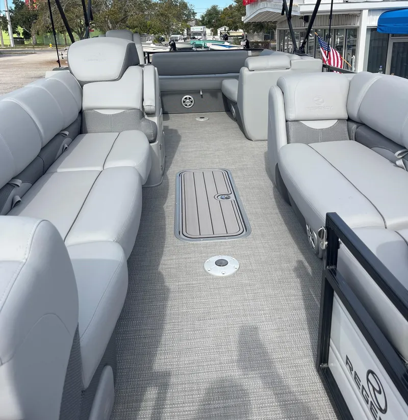 Slide: The Image of 2023 Regency 250 DL3 pontoon boat with spacious seating and modern design. - 3